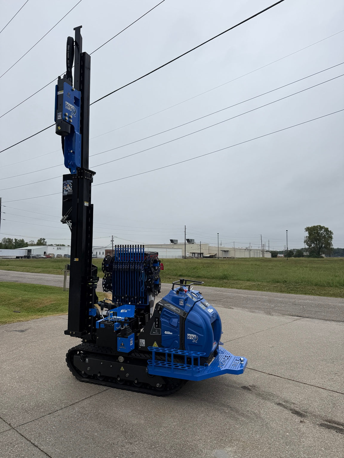 Fence Rex post driver with mast fully extended