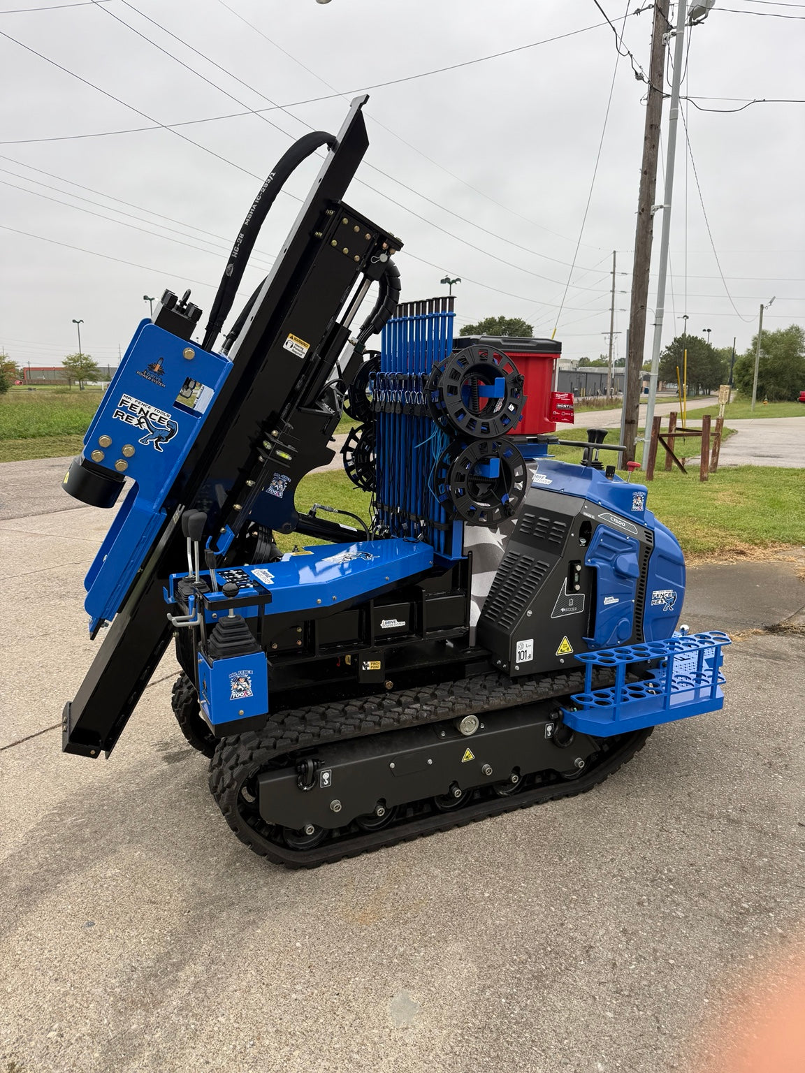 Fence Rex compact tracked post driver with mast and post holding system
