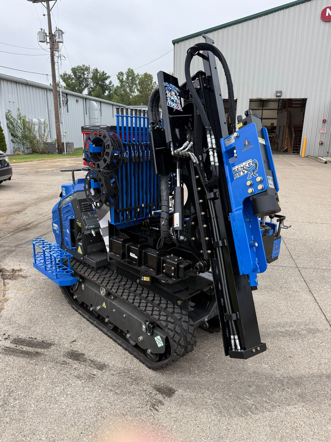 Fence Rex compact tracked post driver, rear three-quarter view
